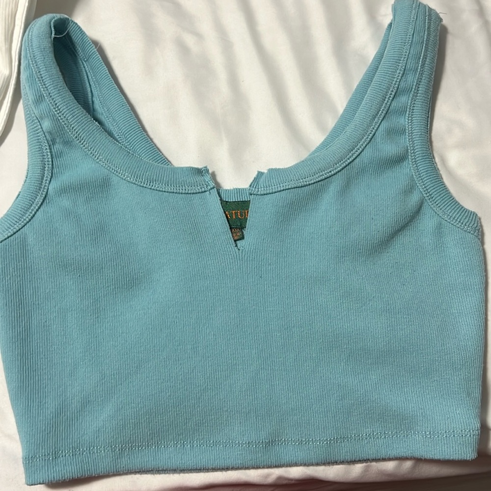 turquoise blue crop top with a slit in the front